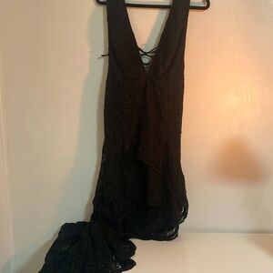 The Deep V Revenge Dress: Black Lace Mini From The Front With Long Tail